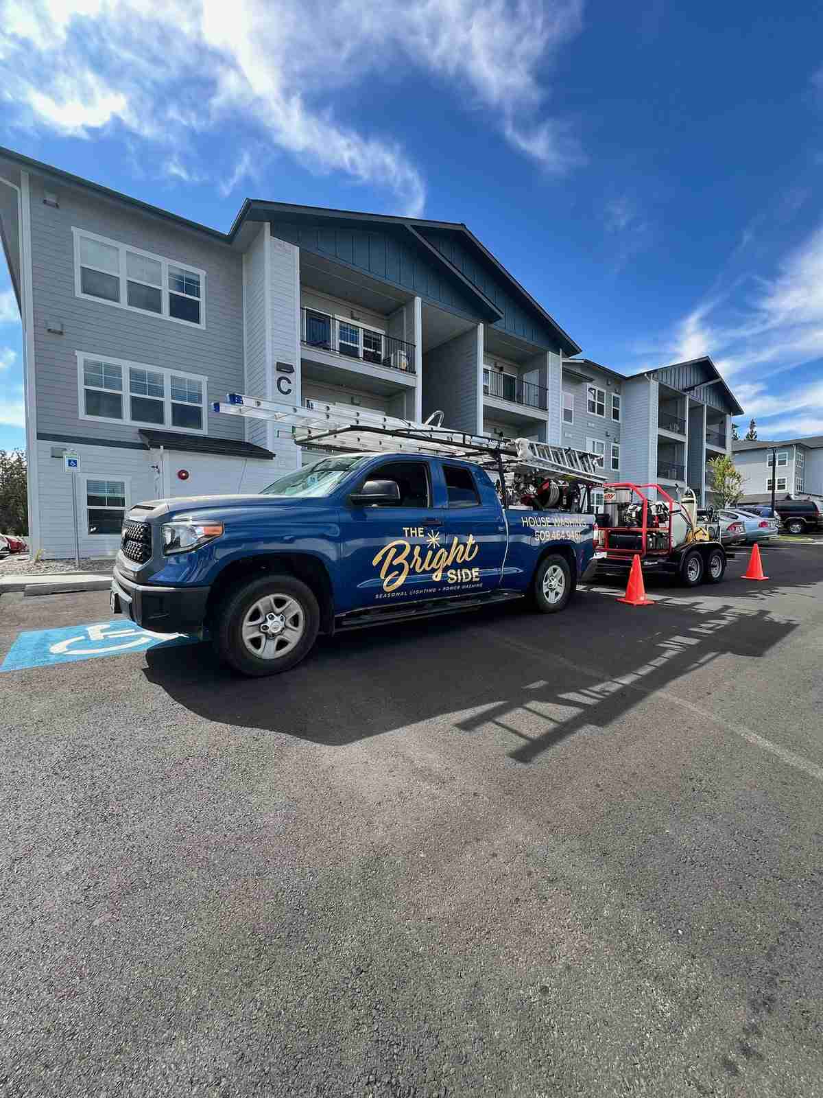 The Bright Side truck and trailer at a Spokane apartment complex for exterior cleaning services.